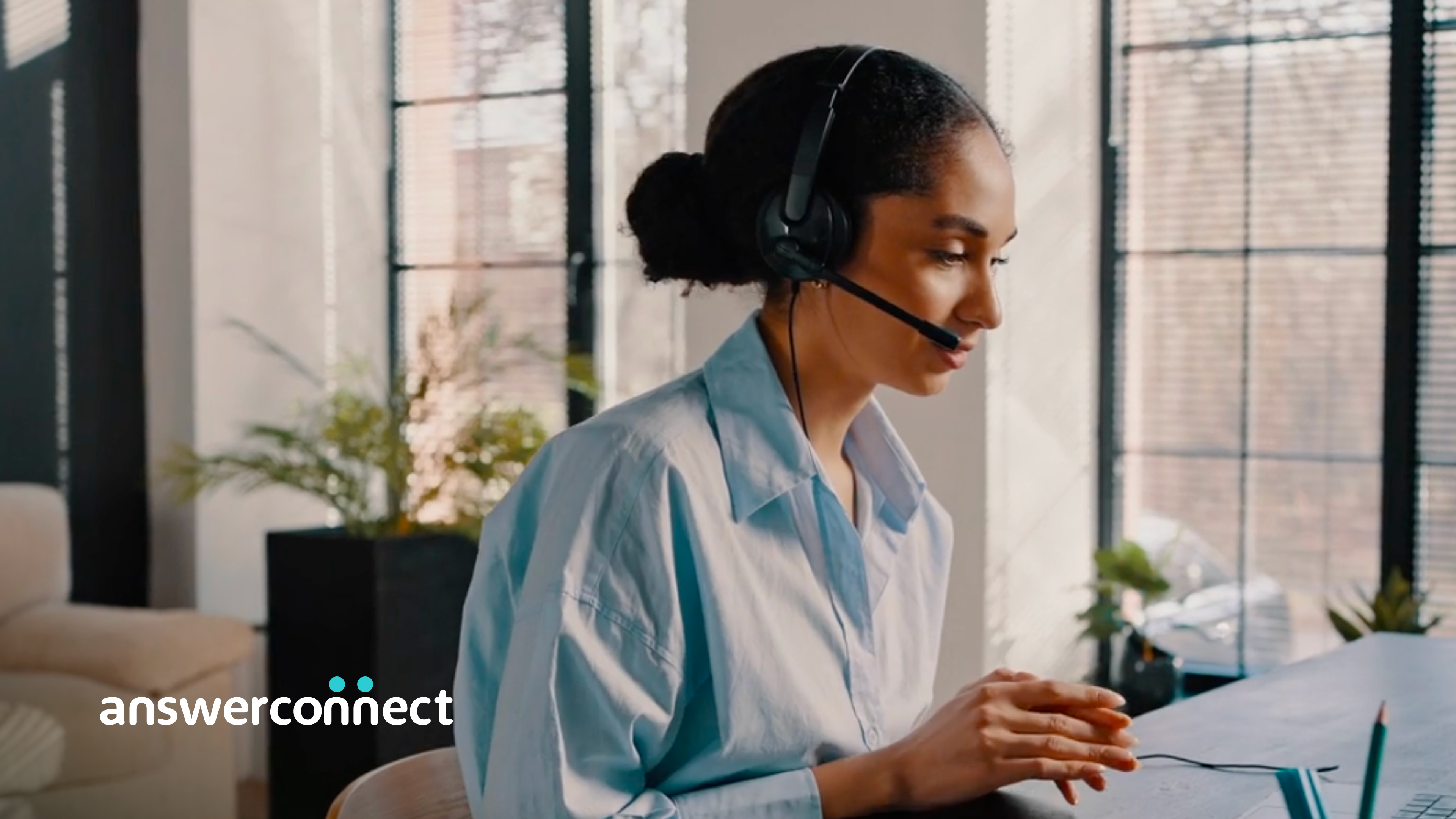 woman with headset typing 